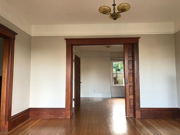 Living room looking into parlor or second bedroom