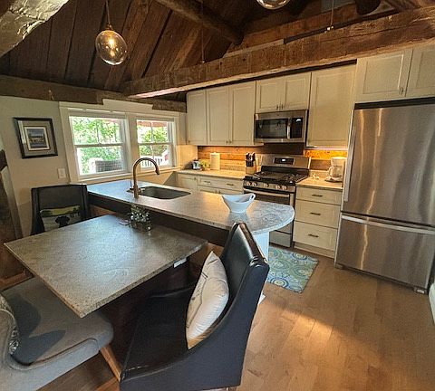 Kitchen windows overlooking the deck and water