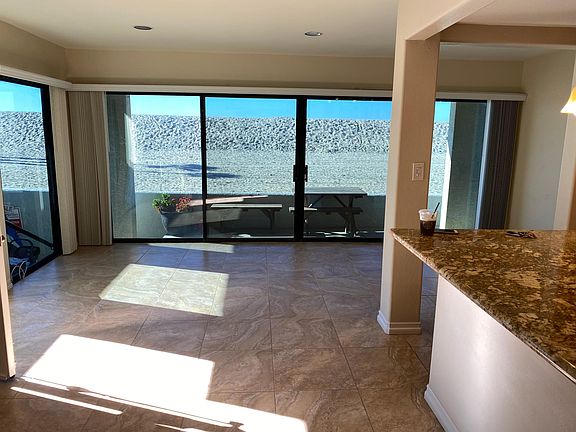 a view of open floor plan with the kitchen island on the right.