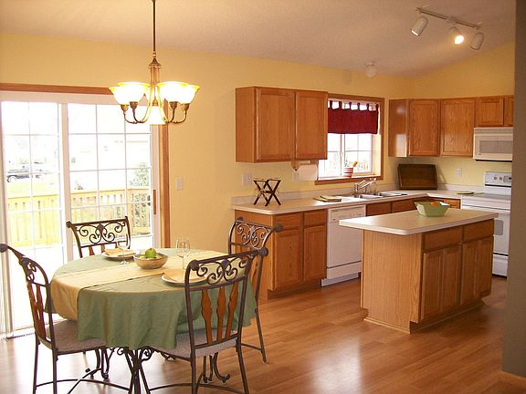 Kitchen with informal dining room and walk out to large deck