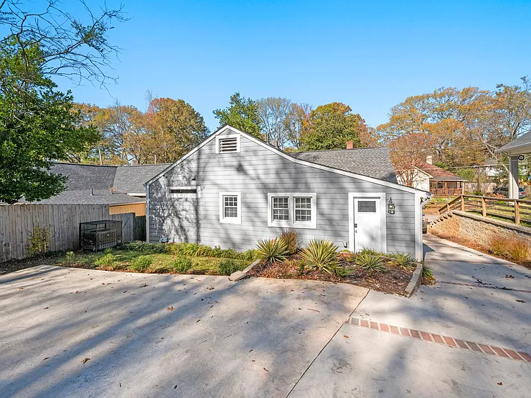 Whether you're looking for a convenient parking space or a serene outdoor retreat, this space offers the perfect blend of functionality and natural beauty, creating a delightful extension of your home for relaxation and enjoyment.