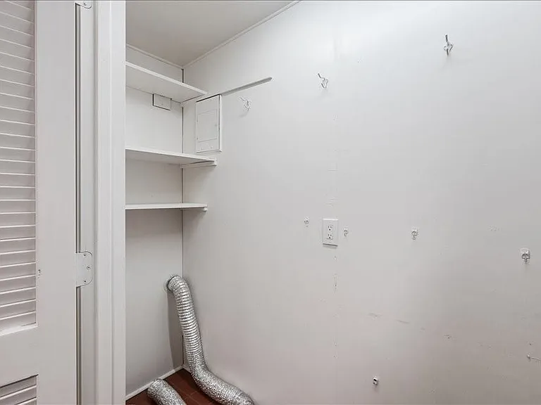 Space for full-size washer and dryer.