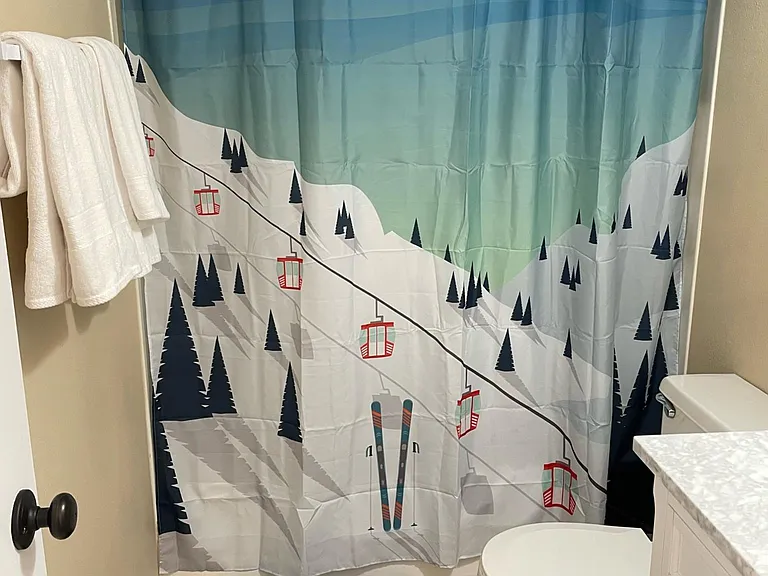 Main bathroom has bathtub shower.