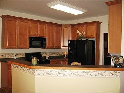 Cooks Delight Kitchen with Cherry Cabinets