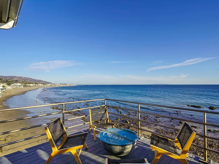Open the doors to your private balcony and let the coastal breeze envelop you.