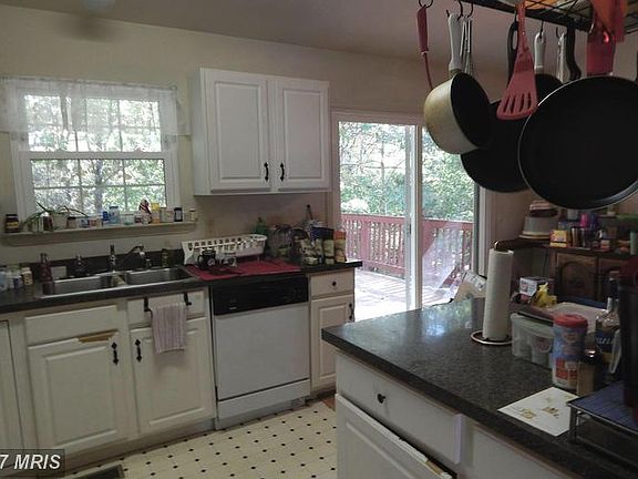 Kitchen view into Dining Rm, Doors to Deck