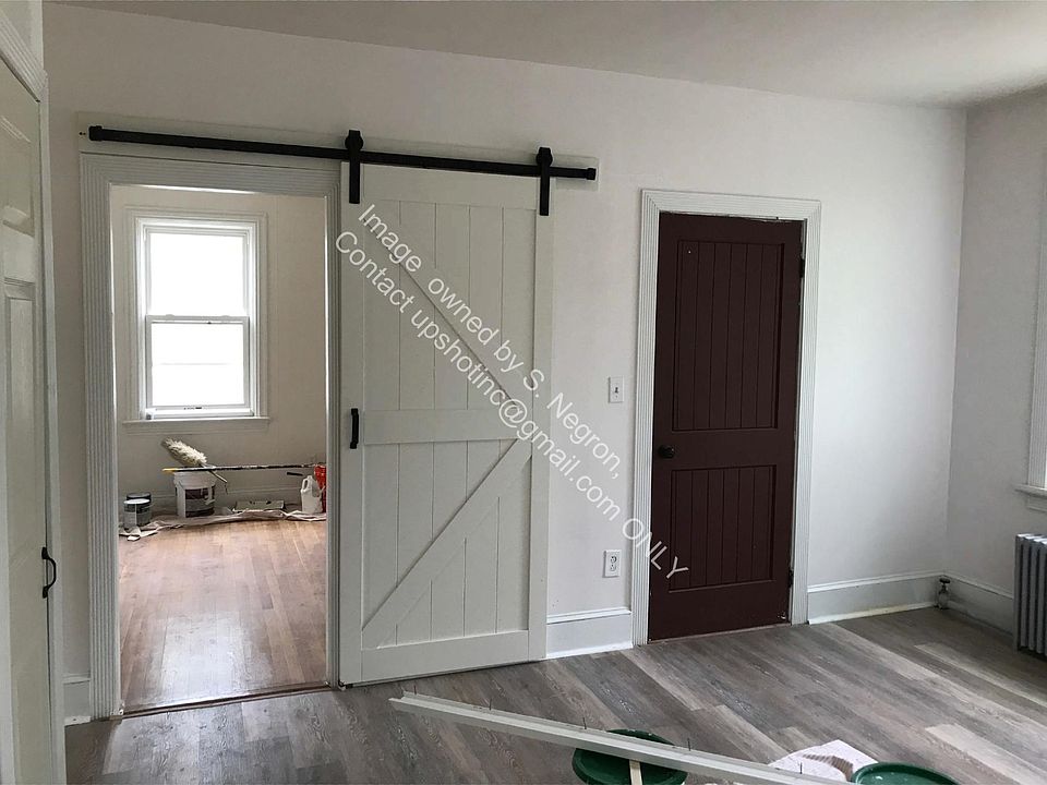 Barn Door off of Kitchen into Bedroom 1