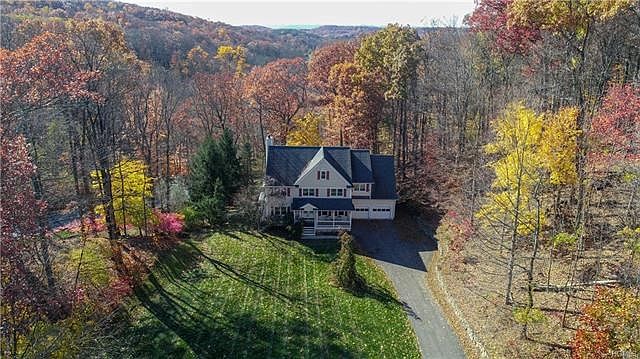 Privately set on pretty property with miles of views from the Family Room windows