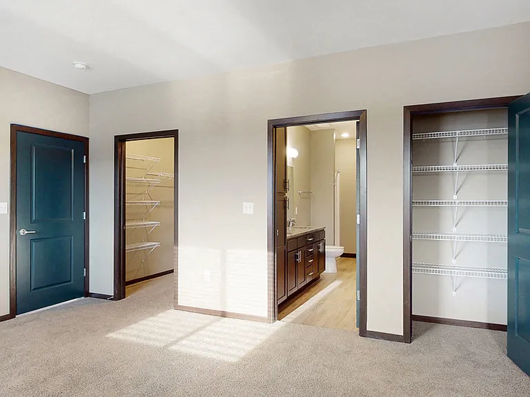 You'll love the large walk-in closet in the master bedroom of the Snowdrop with den floor plan at WH Flats.