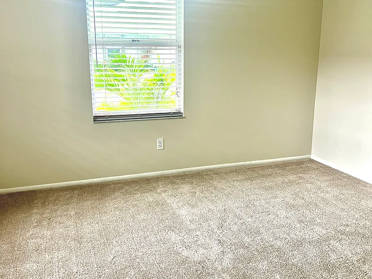 2nd Bedroom with front window facing exterior of villa.