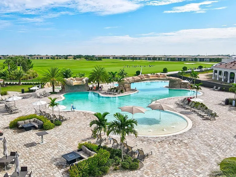 The resort-style main pool incudes lap area, beach entry, 2 waterfall features and a spa.