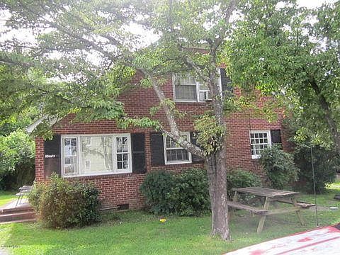 Front view of building Space is located in back on Apt A side