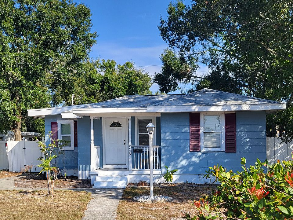 Front porch overlooks large yard