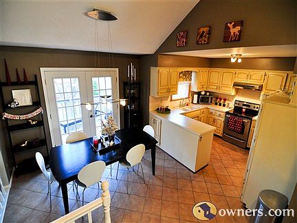 Dining room and kitchen with french doors to deck
