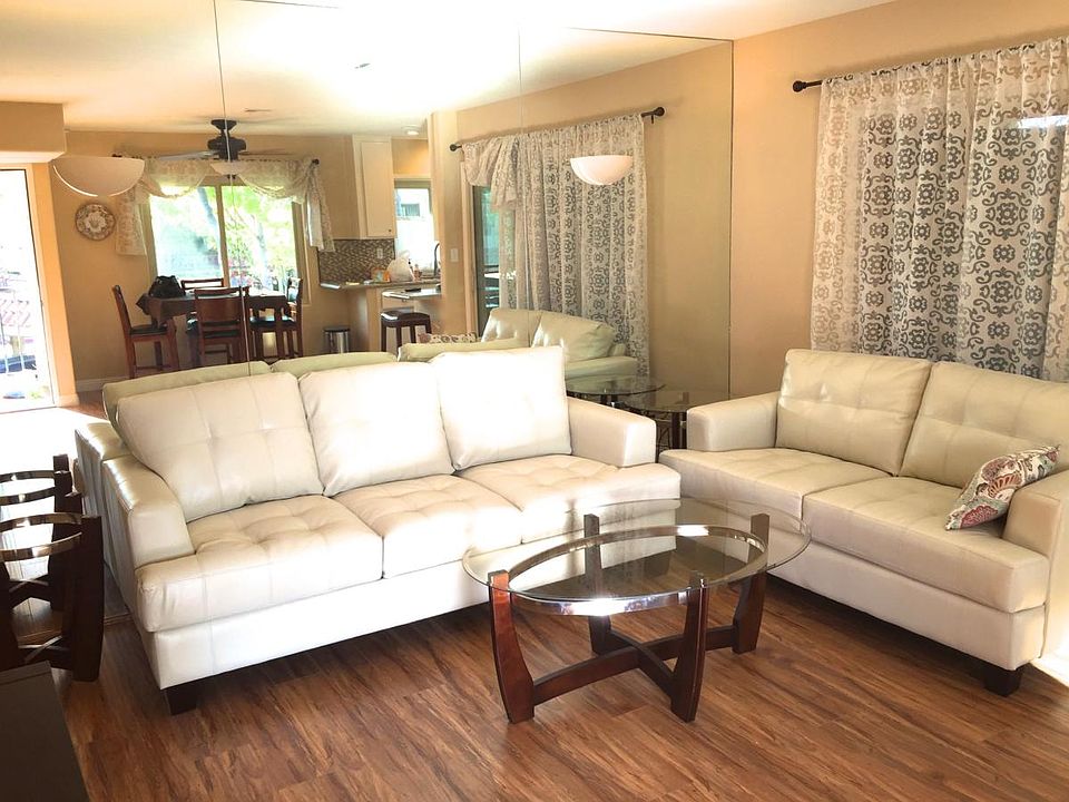 Mirrored Living room, sunny and bright.