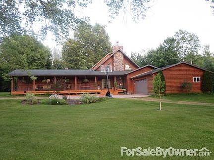 Front Yard : Large front yard with huge covered porch; great for sunsets over the water!