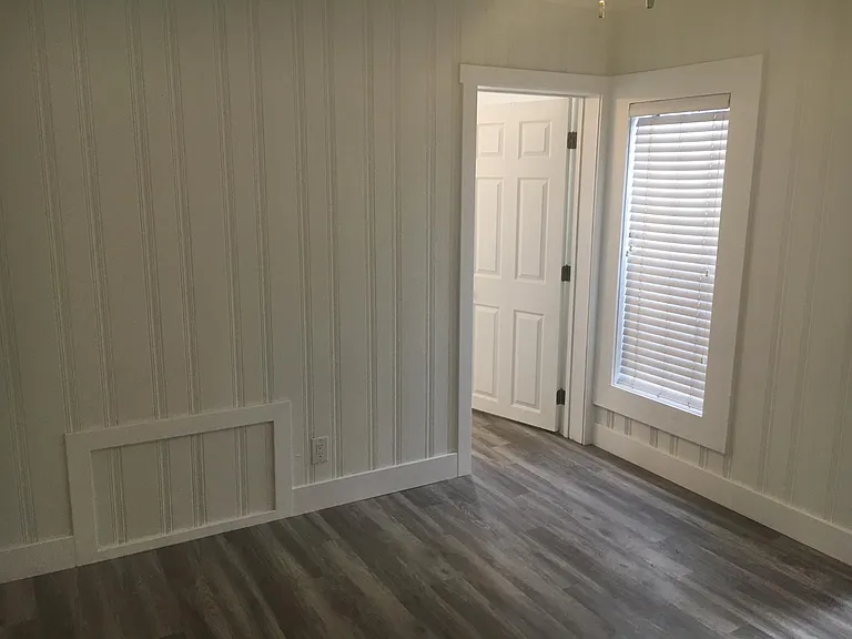 Common room looking at bathroom door.