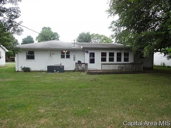 Rear view of home w/ Sunroom