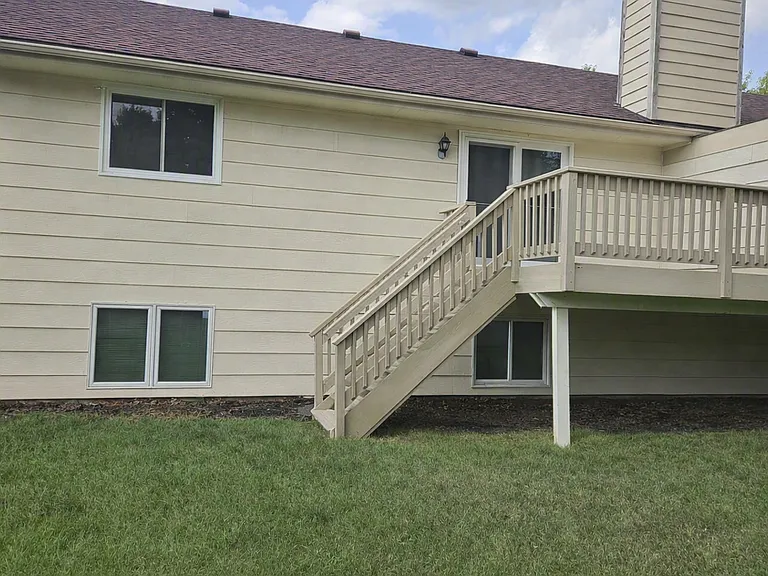 View from backyard towards deck and house