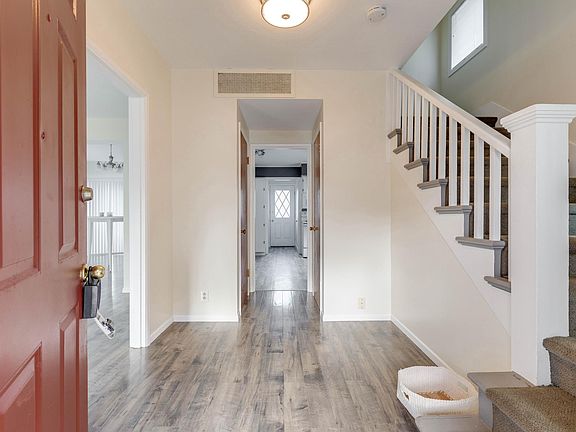 Bright and welcoming entry. Coat closet.