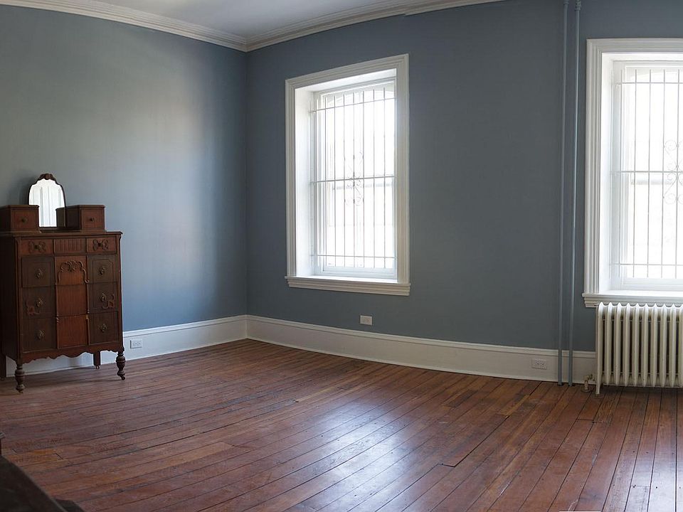 Bedroom 2ndfl front. Gets lots of sund light. has two shallow closets.