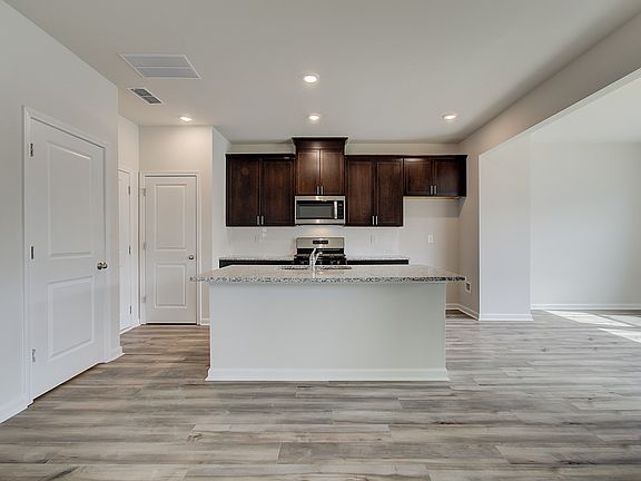 Prepare your favorite meals or catch up with friends around the large kitchen island.