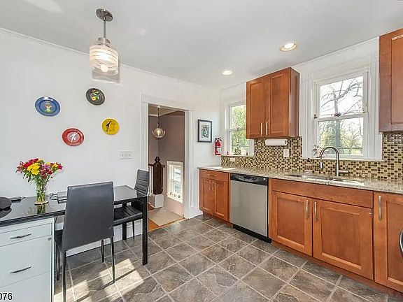 Updated kitchen with stainless steel appliances.