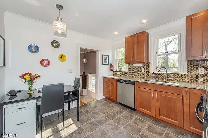 Updated kitchen with stainless steel appliances.
