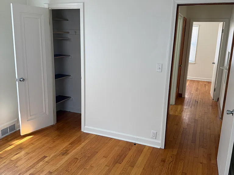 Second bedroom with nice sized closet, beautiful hardwood floors