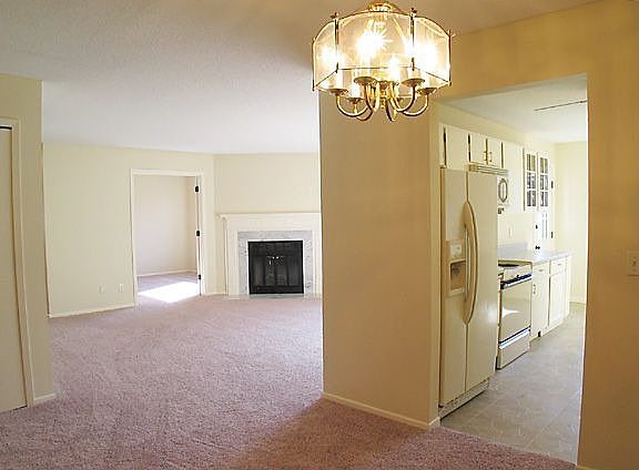 View of kitchen and living room from dining room.