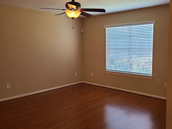 Open Living Room w/ Laminate Floors.