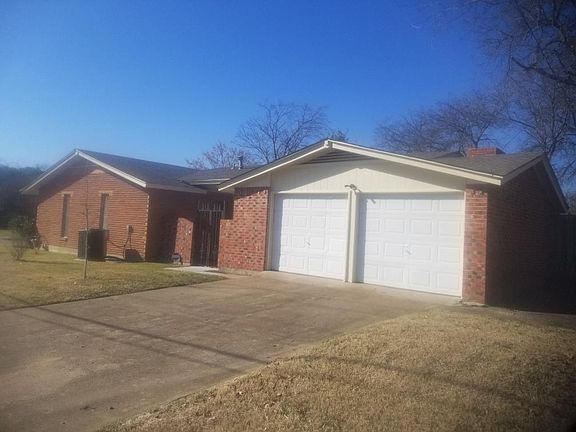 Garage doors with garage door openers, patio that goes to alcove off living room.