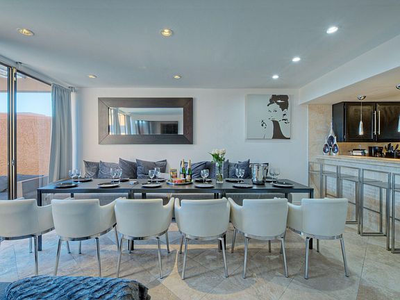 Entertaining Modern Living - Dining - Bar Lounge with long table for larger families/friends including a 70 inch 4k Smart TV next to the outdoor SPA patio.