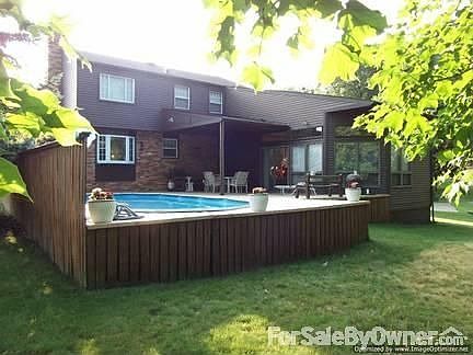 Rear of Property : Completely private and level lot. Tree lined across the back.