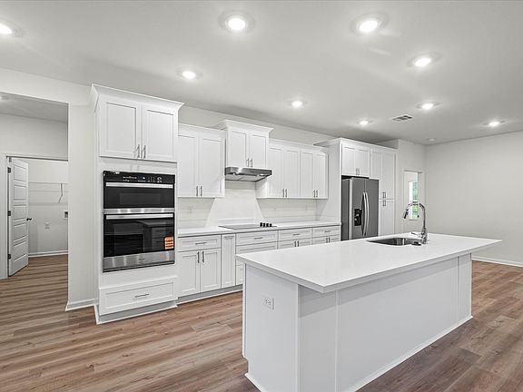 Kitchen in the Brooks floorplan at a Meritage Homes community in Gulfport, MS.