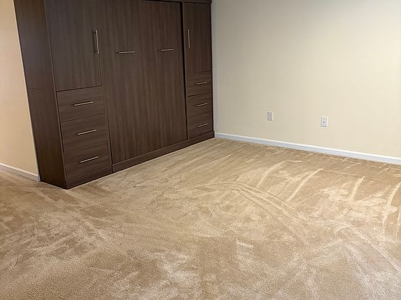Murphy bed/closet/dresser combo in bonus room.