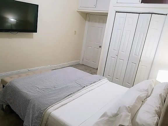 Huge closets with overhead storage in bedroom