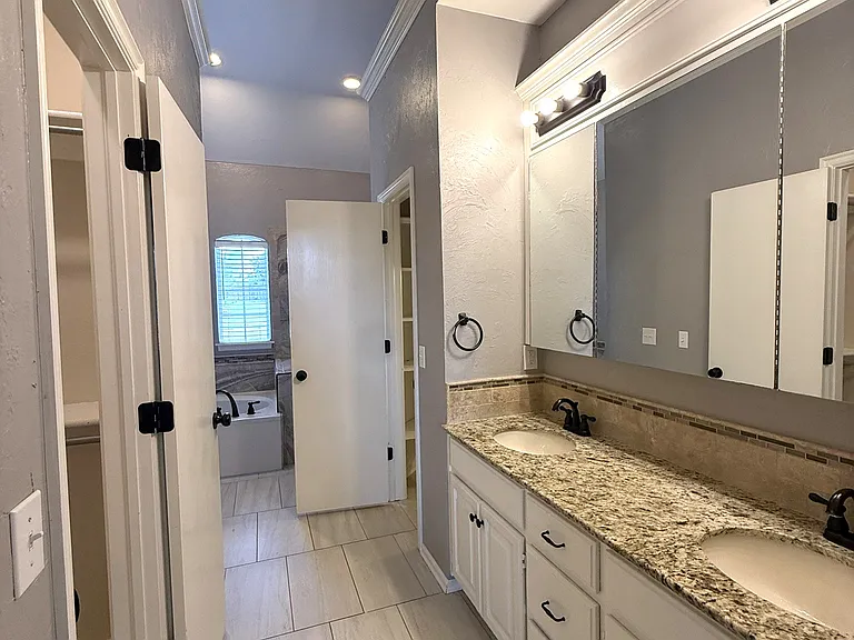 Closet doors both open on the right and left side for his and her closets.