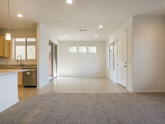 Cafe area situated directly off the kitchen features sliding glass doors that lead to the backyard p