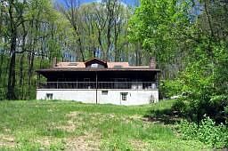 Back of Home surrounded by trees and privacy