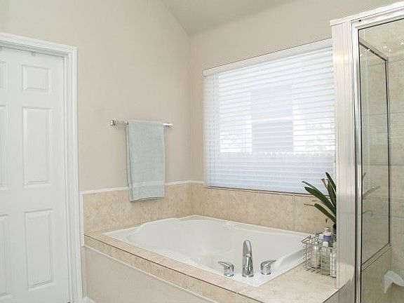 Master bath features double vanity, garden tub, separate shower, & garden tub