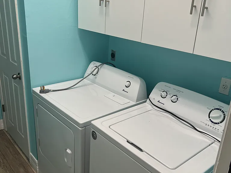 Laundry adjacent to two car garage