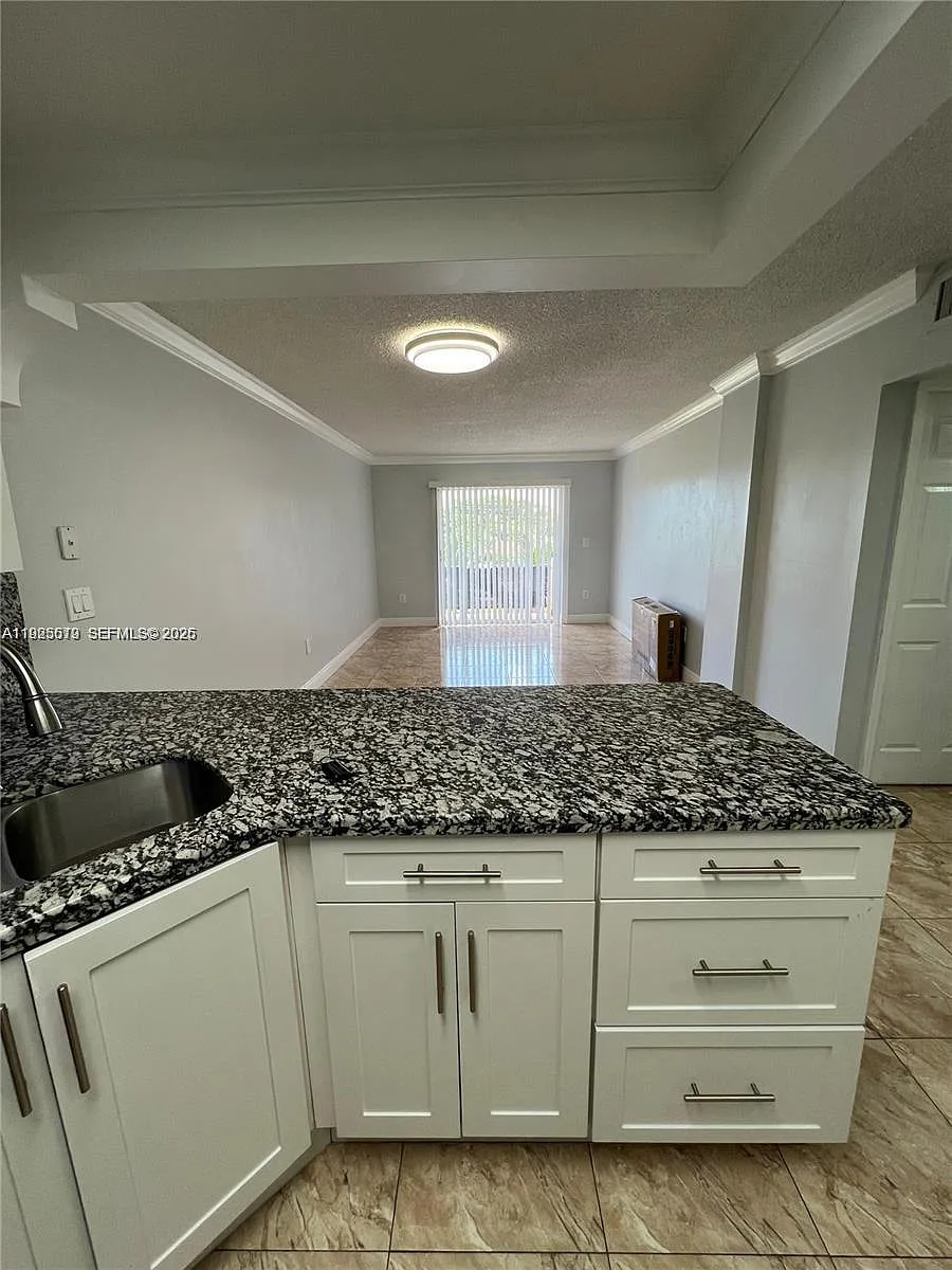 Building Photo - 1075 W 68th St #218