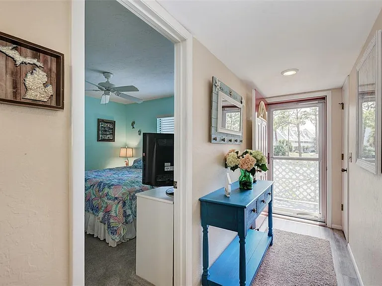 Bright, airy, and inviting. __ We love a home that breathes! By utilizing the front screen door, you can open up the space and truly embrace the indoor-outdoor lifestyle. It makes the "cute and welcoming" entry feel even more spacious.