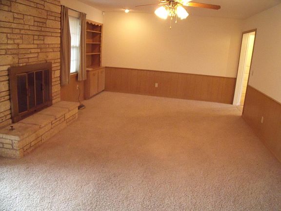 Club Room with gas log fireplace and builtins