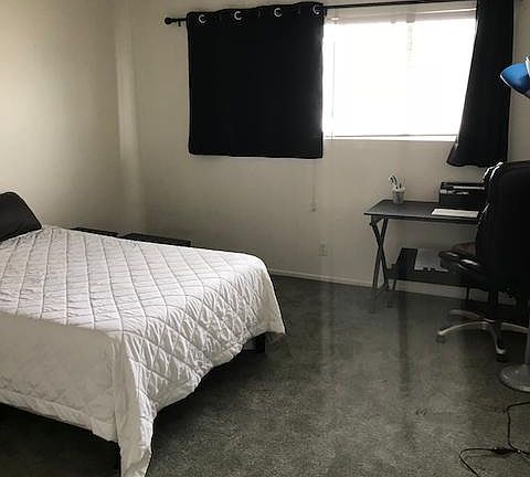 Spacious bedroom with good natural light.