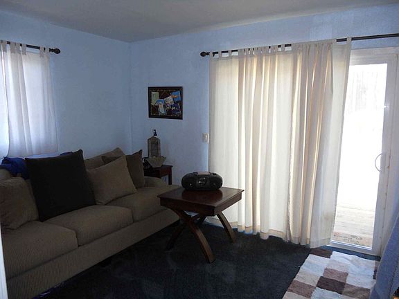 bedroom with sliding door to yard