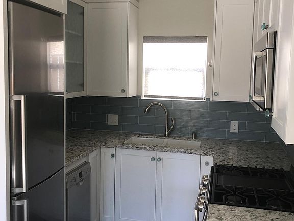 Full kitchen with stainless steel appliances