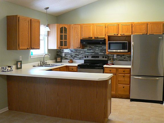 Kitchen with lots of nice cabinets.