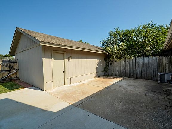Back patio & 2 car detached garage entrance